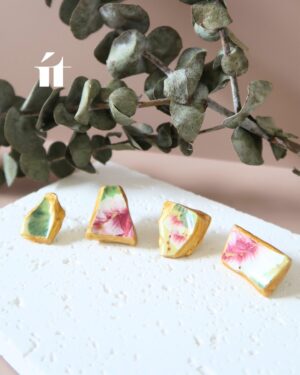 Four variations of Kintsugi earrings from the Kakera collection, made with Song Be pottery shards and gold leaf