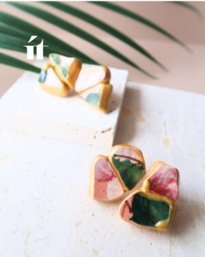 Two pairs of Kintsugi earrings from the Awase collection, showcasing handcrafted variations with Song Be pottery shards and gold leaf